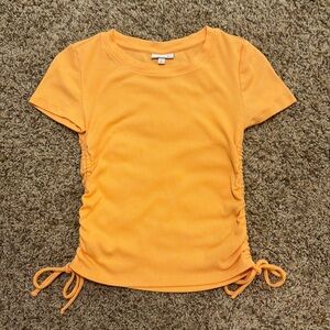 So orange cinch baby tee